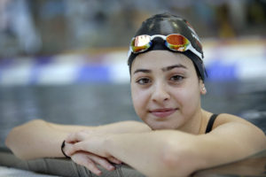 FILE - This is a Monday, Nov. 9, 2015 file photo of Yusra Mardini from Syria poses during a training session in Berlin, Germany. Theyve fled war and violence in the Middle East and Africa. Theyve crossed treacherous seas in small dinghies and lived in dusty refugee camps.They include a teenage swimmer Yusra Mardini from Syria, long-distance runners from South Sudan and judo and taekwondo competitors from Congo, Iran and Iraq. They are striving to achieve a common goal: To compete in the Olympics in Rio de Janeiro. Not for their home countries, but as part of the first ever team of refugee athletes.(AP Photo/Michael Sohn, File)